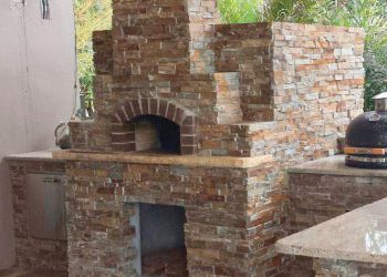 A wood fired pizza oven built into an outdoor kitchen area by Forno Nardona