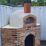 An outdoor brick pizza oven made by Forno Nardona.