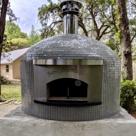 Forno Nardona Napoli oven with engraving Famiglia Maglia and sitting on a customer built base.