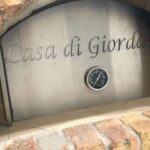 A custom engraved stainless steel plate on a pizza oven made by Forno Nardana.