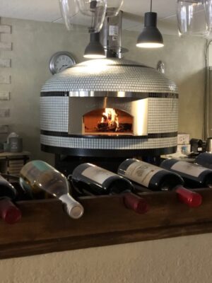 Forno Nardona Napoli Commercial wood fired pizza oven with face plate engraved "Cafe Sahara", a Mediterranean restaurant located in Largo, FL.
