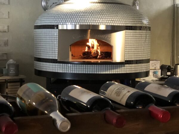Forno Nardona Napoli Commercial wood fired pizza oven with face plate engraved "Cafe Sahara", a Mediterranean restaurant located in Largo, FL.
