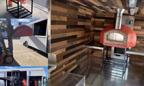 Red commercial Nardona pizza oven in a food truck on stand.