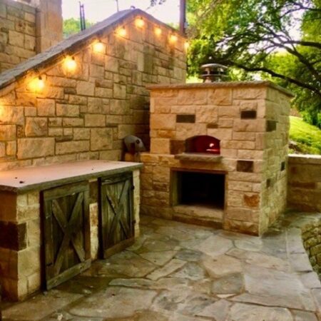 A large, stone outdoor Firenze pizza oven.