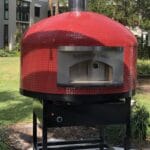 Red Tiled Commercial Napoli oven for Regency Oaks with black grout and black powder coated stand.