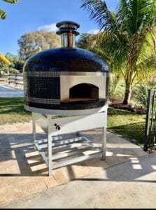 Forno Nardona Napoli oven with blank stainless face plate in grey with white triple stripes on white stainless stand with electronic burner.