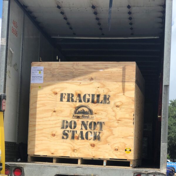 Forno Nardona oven crate on carrier truck with FRAGILE indicated and instructions to DO NOT STACK.