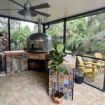 Nardona Napoli Oven in Moon Tile with custom engraving of Forno Ahma on the front sitting atop a customer built base.