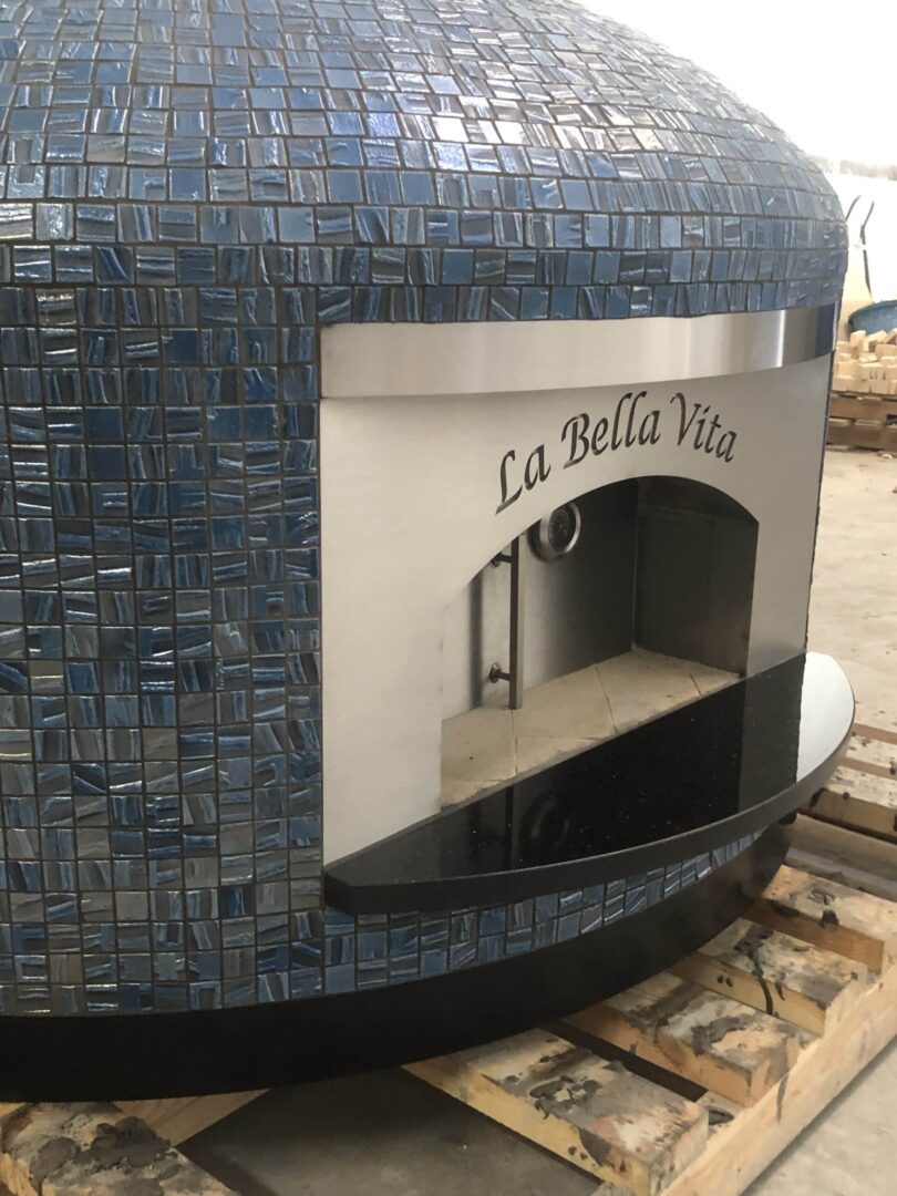 Nardona Napoli 40" in Blue Moon tile with "La Bella Vita" engraved on the front faceplate.