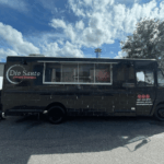 Exterior photo of a custom pizza food truck containing a Nardona Rustica Pizza Oven.