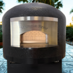 Forno Nardona Napoli Pizza Oven engraved Mangia Bene with the door removed so you can see the interior dome brick and fire brick cooking surface.