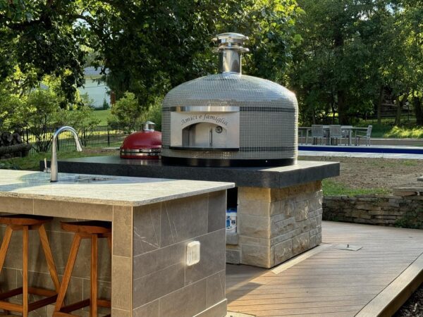 This is just one of Forno Nardons's Napoli 40" residential pizza ovens in Ohio backyard surrounded by trees.