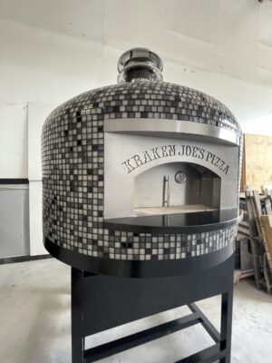 Forno Nardona Napoli 40" Commercial with Kraken Joes Pizza written on the stainless faceplate. oven sits on a black stand.