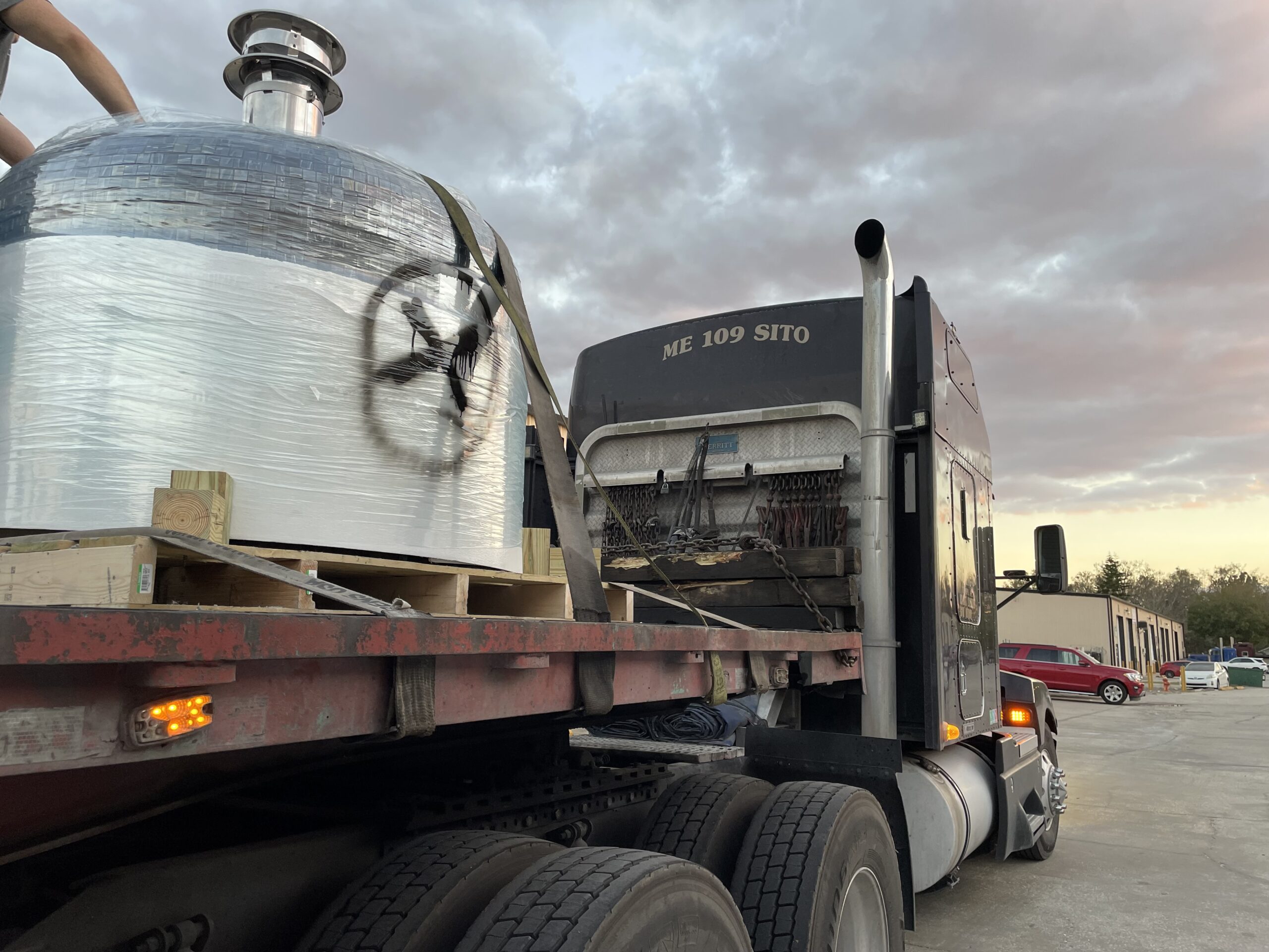 Logistical Considerations when buying a wood-fired brick oven should include how to get this oven off of this truck safely.