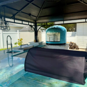 Blue Caribbean Vibes outdoor kitchen with blue oven and granite.