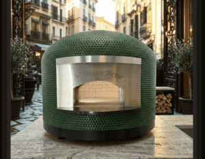 Forno Nardona Napoli Pizza Oven engraved Mangia Bene with the door removed so you can see the interior dome brick and fire brick cooking surface.